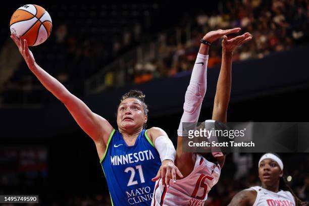 Kayla McBride of the Minnesota Lynx shoots the ball over Brittney Sykes of the Washington Mystics during the second half of the game at Entertainment...