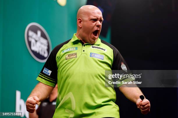 Michael van Gerwen of the Netherlands reacts after defeating Rob Cross of England during the 2023 bet365 U.S. Dart Masters semifinals at The Hulu...