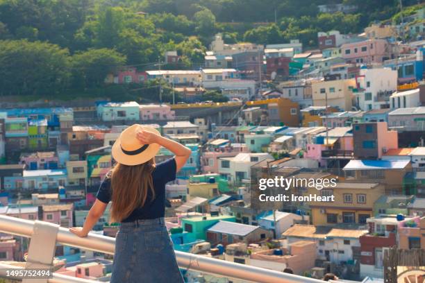 woman tourist is sightseeing at busan gamcheon culture village. - busan fotografías e imágenes de stock