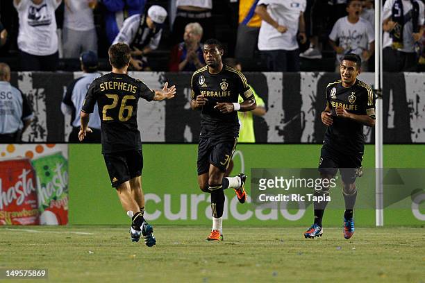 David Junior Lopes of Los Angeles Galaxy celebrates his goal with Michael Stephens of Los Angeles Galaxy during the international friendly match...