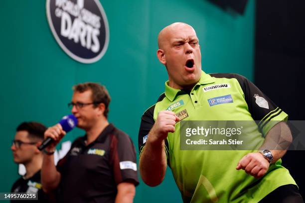 Michael van Gerwen of the Netherlands reacts while competing against Jeff Smith of Canada during the 2023 bet365 U.S. Dart Masters final at The Hulu...