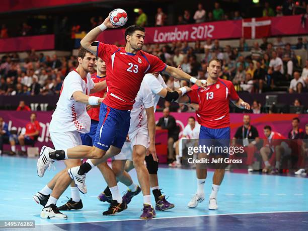 Nenad Vuckovic of Serbia shoots during the Men's Handball Preliminary match between Serbia and Croatia on Day 4 of the London 2012 Olympic Games at...