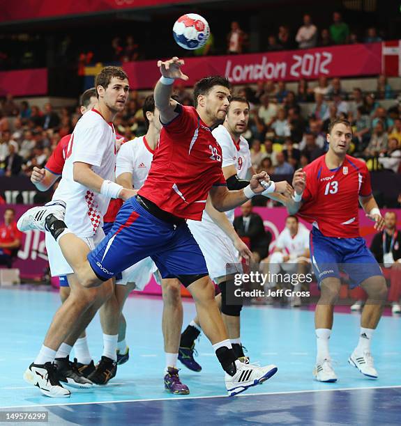 Nenad Vuckovic of Serbia shoots during the Men's Handball Preliminary match between Serbia and Croatia on Day 4 of the London 2012 Olympic Games at...