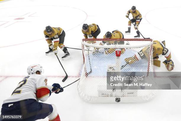 Eric Staal of the Florida Panthers attempts a shot against Adin Hill of the Vegas Golden Knights as William Karlsson defends during the first period...