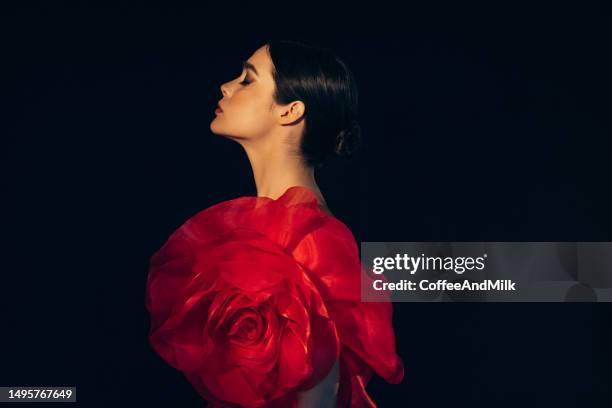 studio shot of young beautiful woman wearing amazing dress - red dress stock pictures, royalty-free photos & images