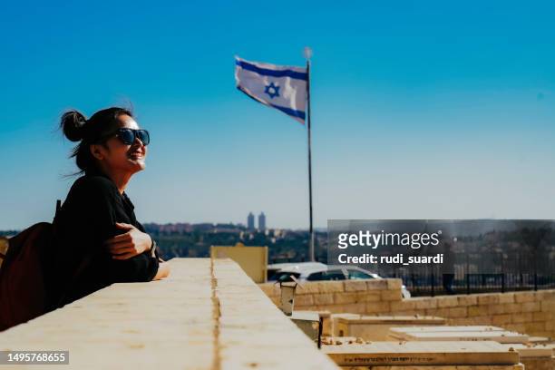 asian woman standing at the old town with the dome of the rock at the sunset from mount of olives - jerusalem archaeology stock pictures, royalty-free photos & images
