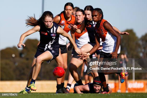 Sara Howley of the Falcons and Marika Carlton of Northern Territory contest the ball during the round nine Coates Talent League Girls match between...