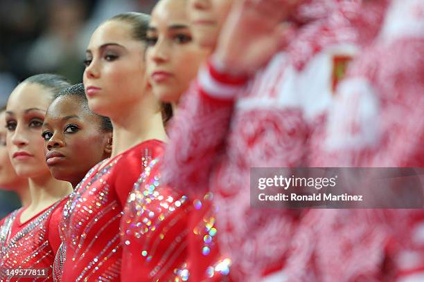 Gabrielle Douglas of the United States of America looks down at her teammates during introductions before the Artistic Gymnastics Women's Team final...