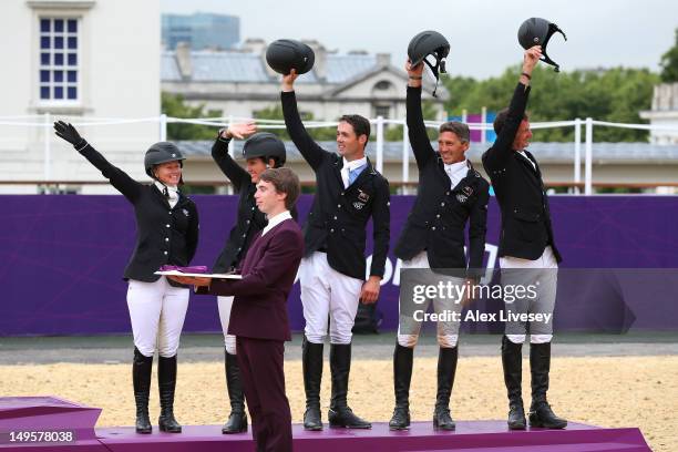 The New Zealand team celebrate after being presented with their Bronze Medal in the Eventing Team Jumping Final Equestrian event on Day 4 of the...