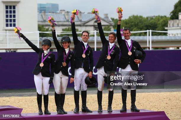 The New Zealand team celebrate after being presented with their Bronze Medal in the Eventing Team Jumping Final Equestrian event on Day 4 of the...