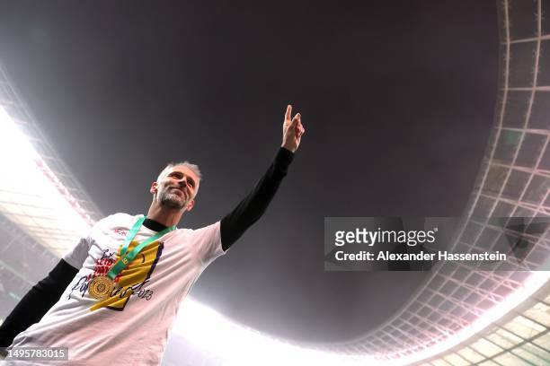 Marco Rose, Head Coach of RB Leipzig, acknowledges the fans following the team's victory during the DFB Cup final match between RB Leipzig and...