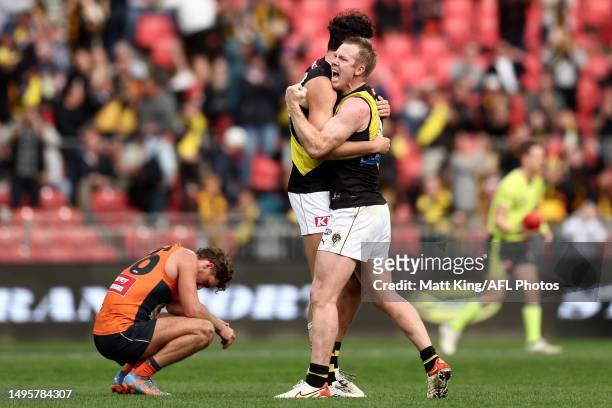 Jack Riewoldt of the Tigers celebrates victory with Samson Ryan of the Tigers at the final siren during the round 12 AFL match between Greater...