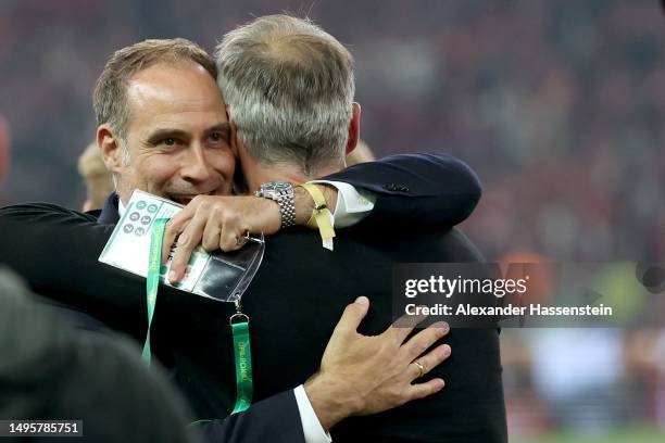 Oliver Mintzlaff, CEO Corporate Projects and Investments of Red Bull celebrates with head coach Marco Rose after winning the DFB Cup final match...