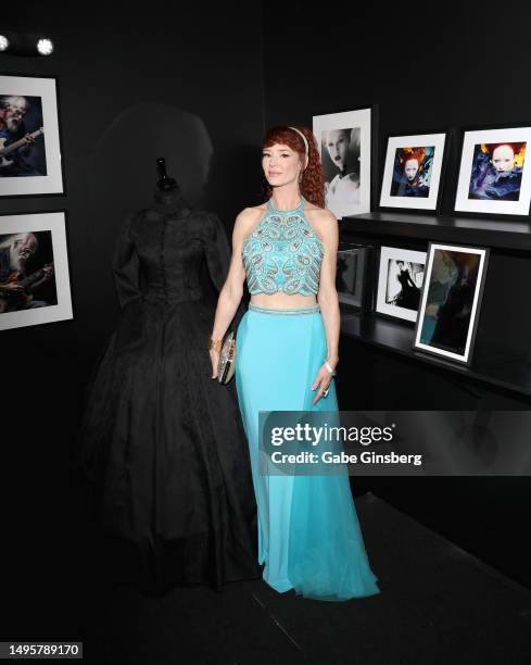 Audrey Hollander poses next to some images of her being displayed during the opening night of The Catherine exhibit at The Erotic Heritage Museum on...