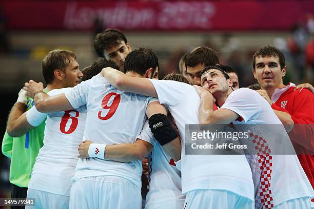 Croatia players celebrate victory after the Men's Handball Preliminary match between Serbia and Croatia on Day 4 of the London 2012 Olympic Games at...