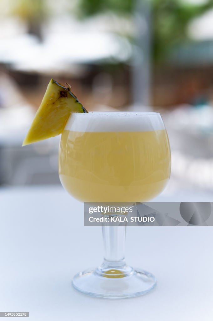 Refreshing pineapple drink on an outdoor terrace. pina colada