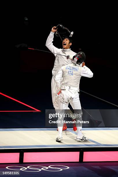 Sheng Lei of China celebrates winning his Men's Foil Individual Semifinal against Andrea Baldini of Italy on Day 4 of the London 2012 Olympic Games...