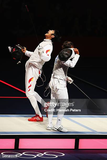 Sheng Lei of China celebrates winning his Men's Foil Individual Semifinal against Andrea Baldini of Italy on Day 4 of the London 2012 Olympic Games...