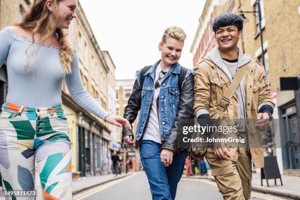 cheerful gen z friends exploring brick lane in east end - brick lane inner london stock pictures, royalty-free photos & images