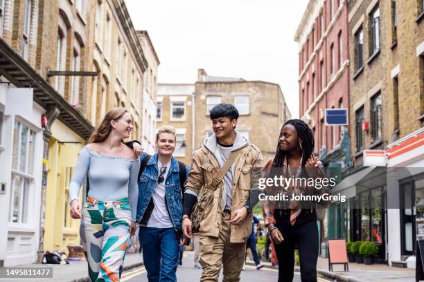 four gen z friends side by side and exploring east end - brick lane inner london stock pictures, royalty-free photos & images