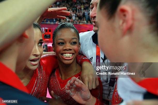 Gabrielle Douglas of the United States celebrates with teammates during the Artistic Gymnastics Women's Team final on Day 4 of the London 2012...