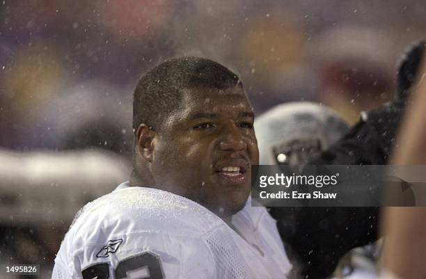 Lincoln Kennedy of the Oakland Raiders obsereves the AFC playoff game against the New England Patriots at Foxboro Stadium in Foxboro, Massachuesetts....