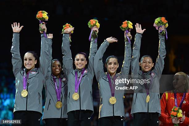 Gold medalist Team US Jordyn Wieber, Gabrielle Douglas, Mckayla Maroney, Alexandra Raisman and Kyla Ross celebrate on the podium of the women's team...