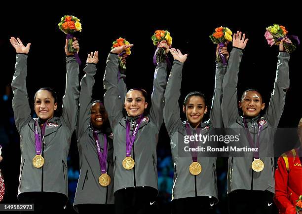 Jordyn Wieber, Gabrielle Douglas, Mc Kayla Maroney, Alexandra Raisman and Kyla Ross of the United States celebrate on the podium after winning the...