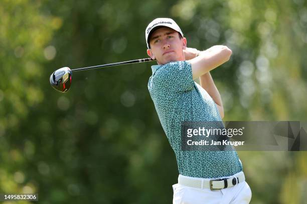 Tom McKibbin of Northern Ireland plays his tee shot on the 4th hole on Day Four of the Porsche European Open at Green Eagle Golf Course on June 04,...