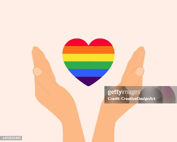 ilustraciones, imágenes clip art, dibujos animados e iconos de stock de manos con corazón de color arco iris. mes del orgullo, derechos lgbtq y concepto de igualdad de género - bandera del arco iris