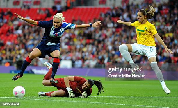 Stephanie Houghton of Great Britain skips over Andreia of Brazil to score the opening goal during the Women's Football first round Group E Match...