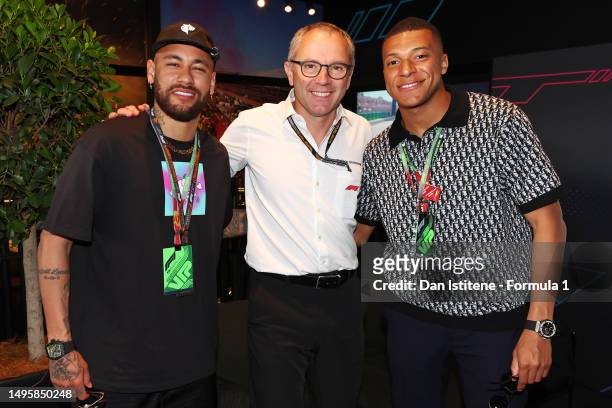 Neymar, Stefano Domenicali, CEO of the Formula One Group, and Kylian Mbappe pose for a photo prior to the F1 Grand Prix of Spain at Circuit de...