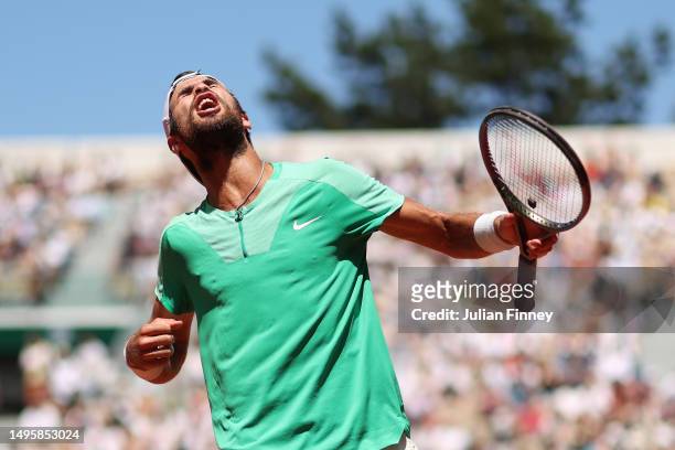 Karen Khachanov celebrates winning match point against Lorenzo Sonego of Italy during the Men's Singles Fourth Round match on Day Eight of the 2023...