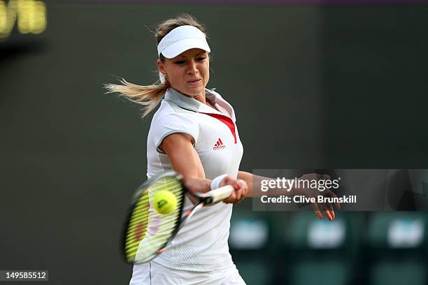 Maria Kirilenko of Russia returns a shot against Heather Watson of Great Britain during the second round of Women's Singles Tennis on Day 4 of the...