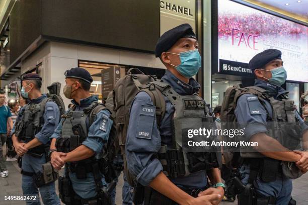 Counter Terrorism Response Unit stand guard at Causeway Bay near Victoria Park on June 04, 2023 in Hong Kong, China. Victoria Park, where Hong Kong...