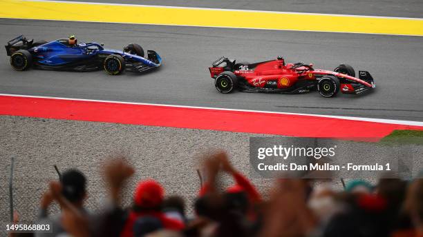 Charles Leclerc of Monaco driving the Ferrari SF-23 leads Logan Sargeant of United States driving the Williams FW45 Mercedes on track during the F1...