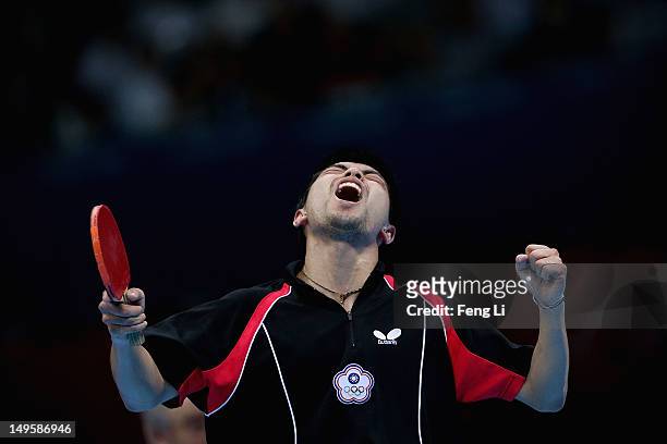 Chih-Yuan Chuang of Chinese Taipei celebrates winning during the Men's Singles Table Tennis quarter-final match against Adrian Crisan of Romania on...