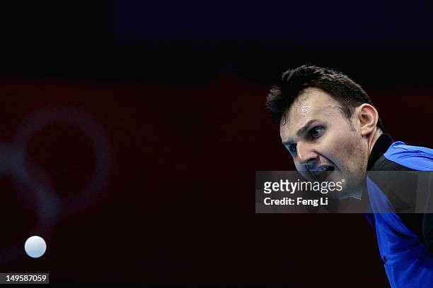 Adrian Crisan of Romania competes during the Men's Singles Table Tennis quarter-final match against Chih-Yuan Chuang of Chinese Taipei on Day 4 of...