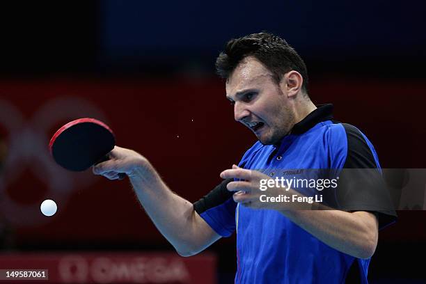 Adrian Crisan of Romania competes during the Men's Singles Table Tennis quarter-final match against Chih-Yuan Chuang of Chinese Taipei on Day 4 of...