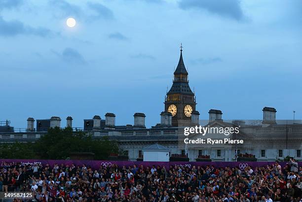 Big Ben is seen over the top of Horse Guards as spectators watch the Women's Beach Volleyball Preliminary match between Canada and Russia on Day 4 at...