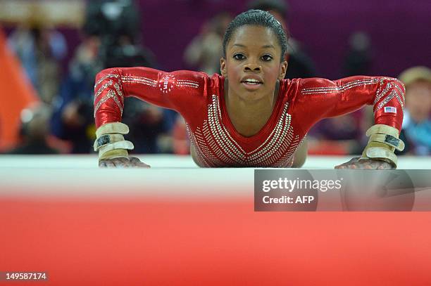 Gymnast Gabrielle Douglas performs on the floor during the women's team final of the artistic gymnastics event of the London Olympic Games on July...