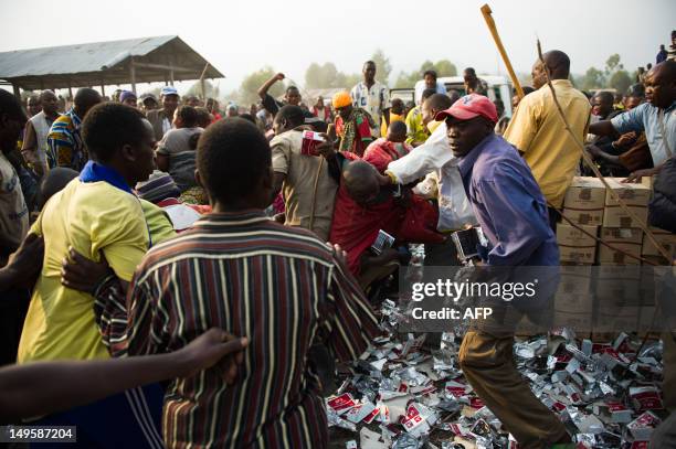 Displaced Congolese people fight for food rations at a World Food Programme distribution in Kanyarucinya on the outskirts of Goma in the east of the...