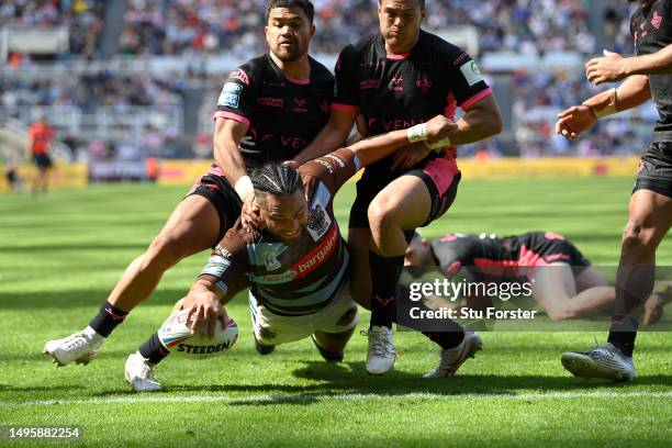 St Helens player Konileti Hurrell dives over to score a try during the Betfred Super League Magic Weekend match between St Helens and Huddersfield...