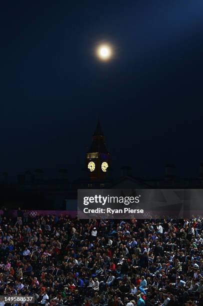 Big Ben and the moon is seen over the top of Horse Guards during the Women's Beach Volleyball Preliminary match between Canada and Russia on Day 4 at...