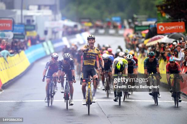 Christophe Laporte of France and Team Jumbo-Visma celebrates at finish line as stage winner ahead of Matteo Trentin of Italy and UAE Team Emirates,...
