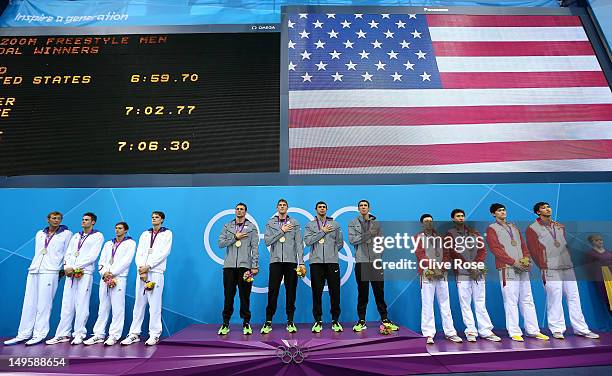 Silver medallists France, gold medallists the United States and bronze medallists China pose on the podium during the medal ceremony for the Men's 4...
