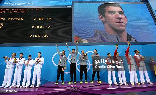 Silver medallists France, gold medallists the United States and bronze medallists China pose on the podium during the medal ceremony for the Men's 4...