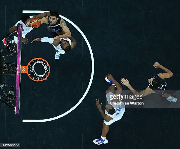 Carlos Delfino of Argentina lays up in the Men's Basketball Preliminary Round match between France and Argentina on Day 4 of the London 2012 Olympic...