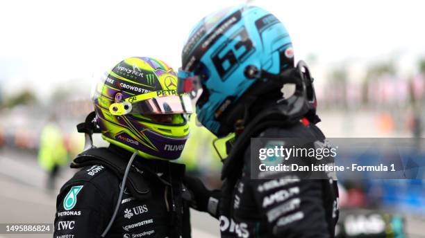 Second placed Lewis Hamilton of Great Britain and Mercedes and Third placed George Russell of Great Britain and Mercedes celebrate in parc ferme...