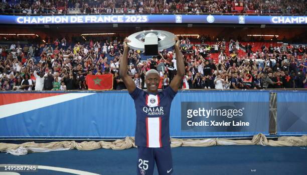 Nuno Mendes of Paris Saint-Germain celebrates the championship trophy after the Ligue 1 match between Paris Saint-Germain and Clermont Foot at Parc...
